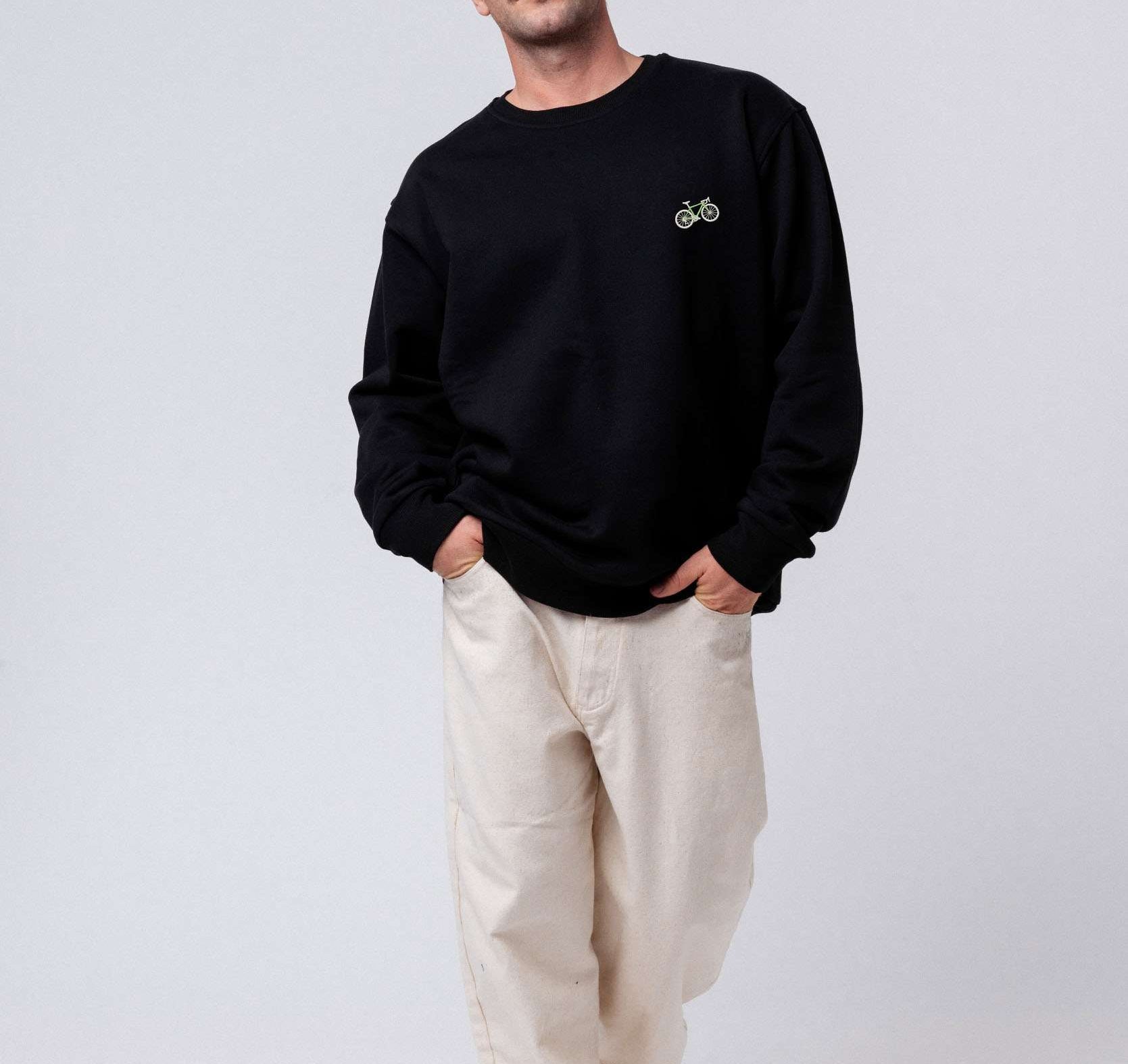 Gravelbike Gruen Pullover schwarz
